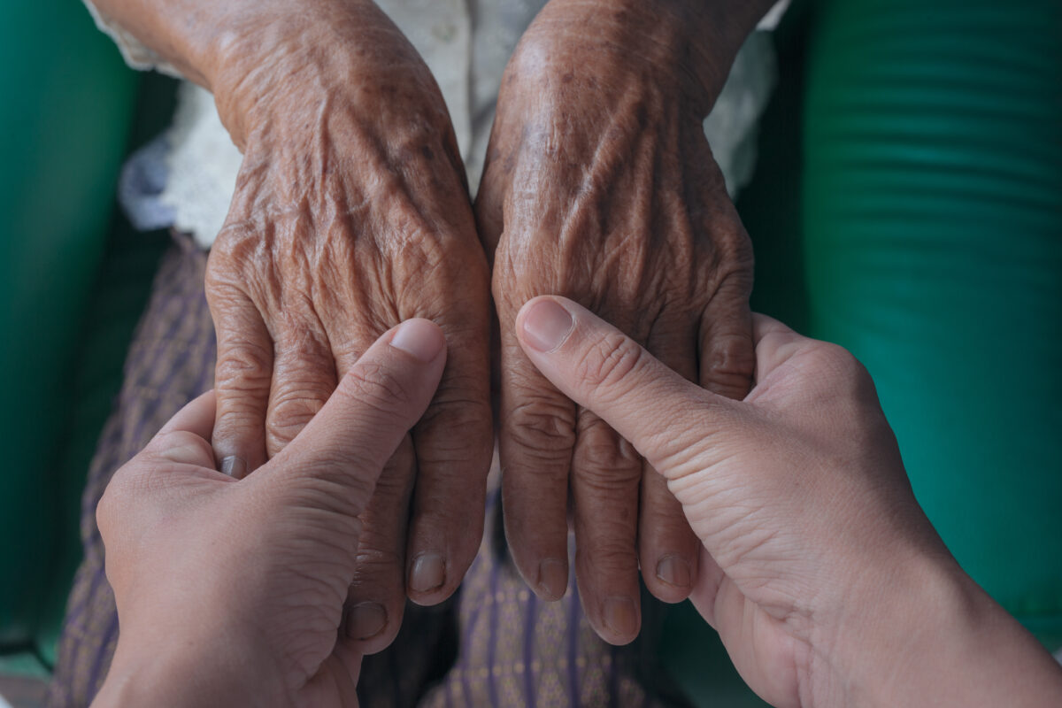 young-woman-holding-elderly-woman-s-hand-1200x800.jpg